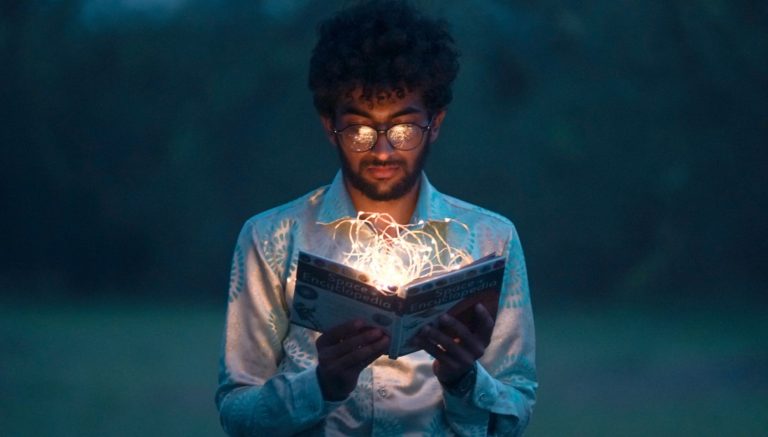 man holding book